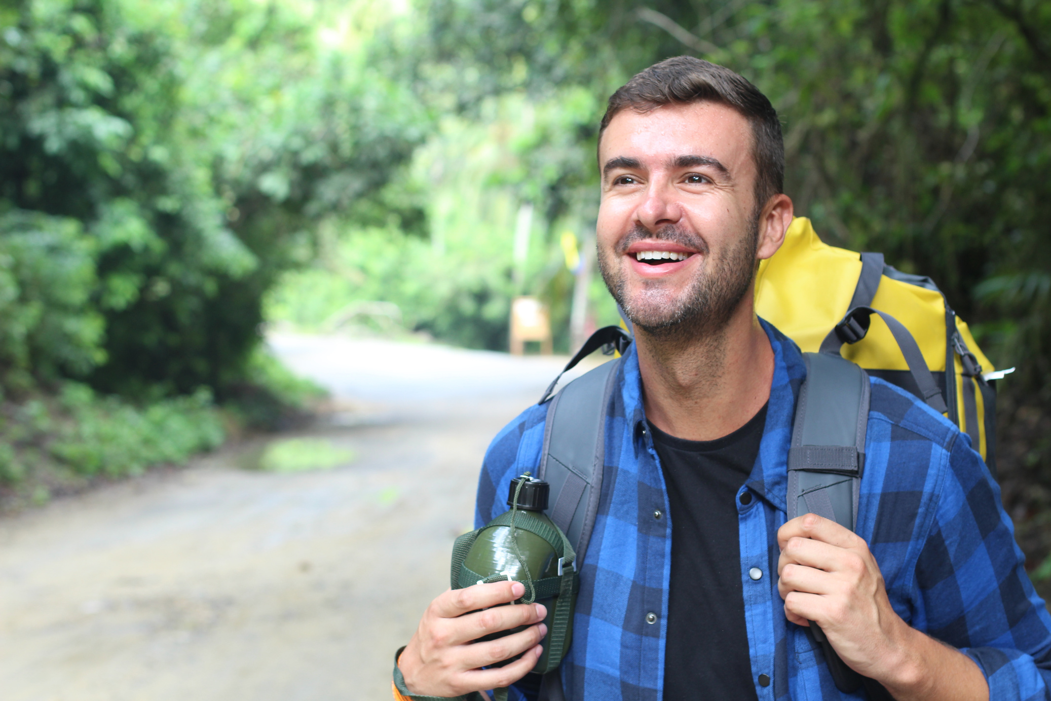 Healthy backpacker going through the jungle